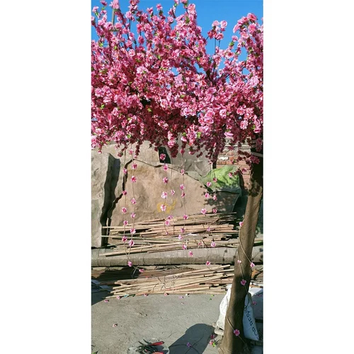 One sided artificial pink blossom tree